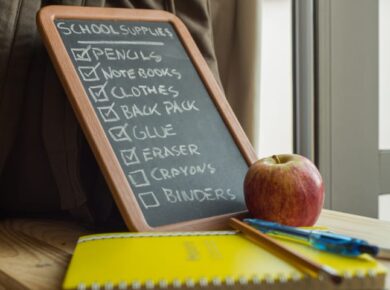 List of school supplies on small chalkboard