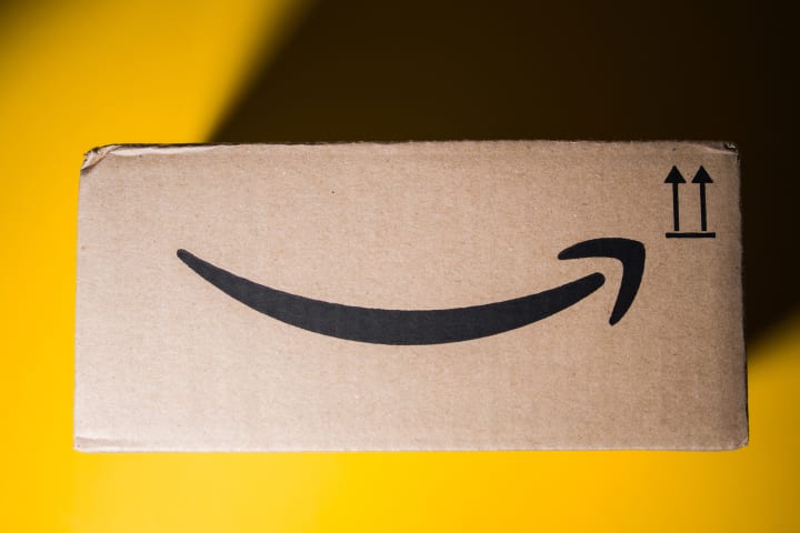 Amazon box on a yellow background